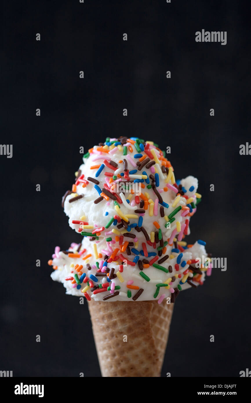 Close up of ice cream cone with sprinkles Stock Photo