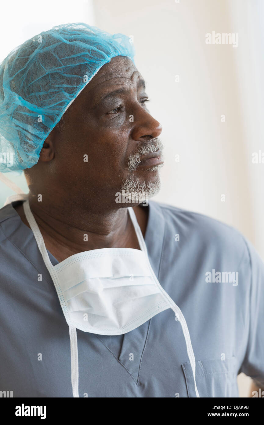 Black surgeon standing in hospital Stock Photo
