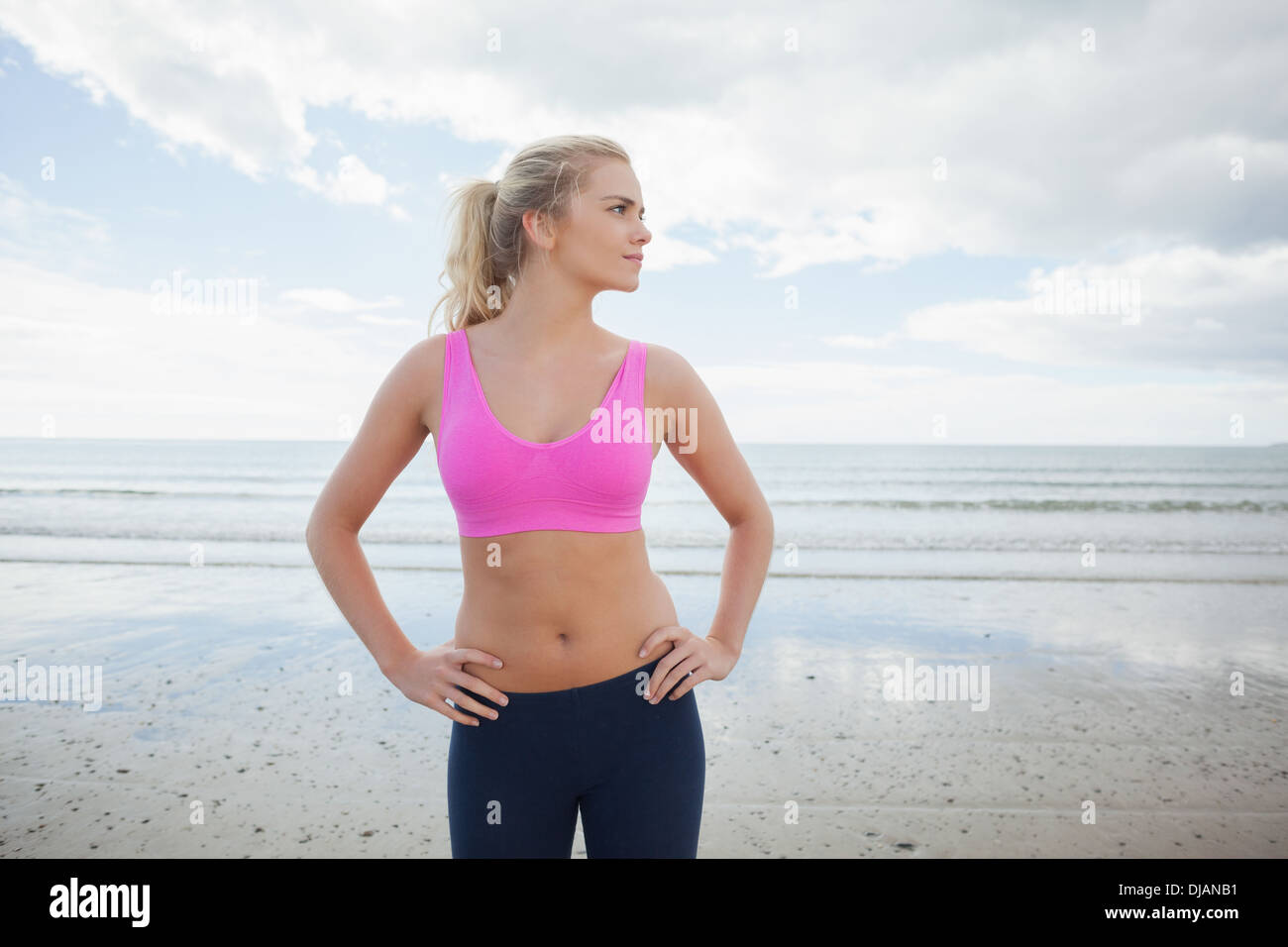 Young woman sportswear hands hips hi-res stock photography and
