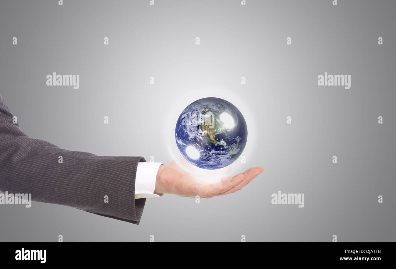 business man with earth globe in his hand, grey background Stock Photo ...