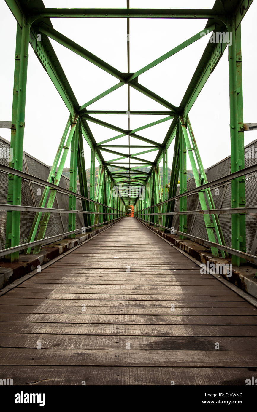 Footbridge with symmetrical metal structure Stock Photo