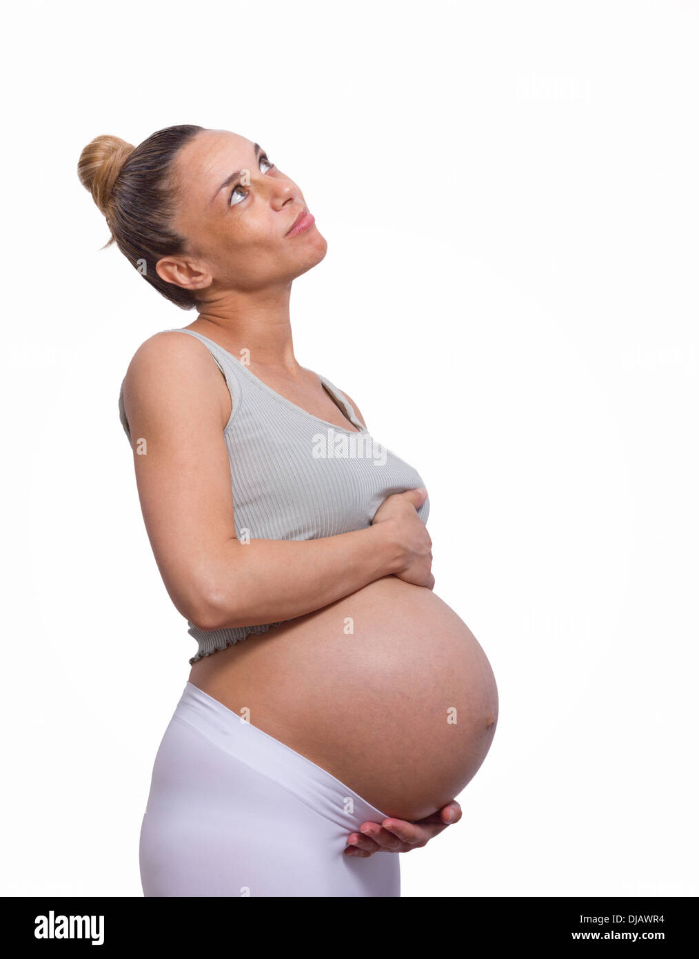 pregnant woman holding her big belly Stock Photo Alamy