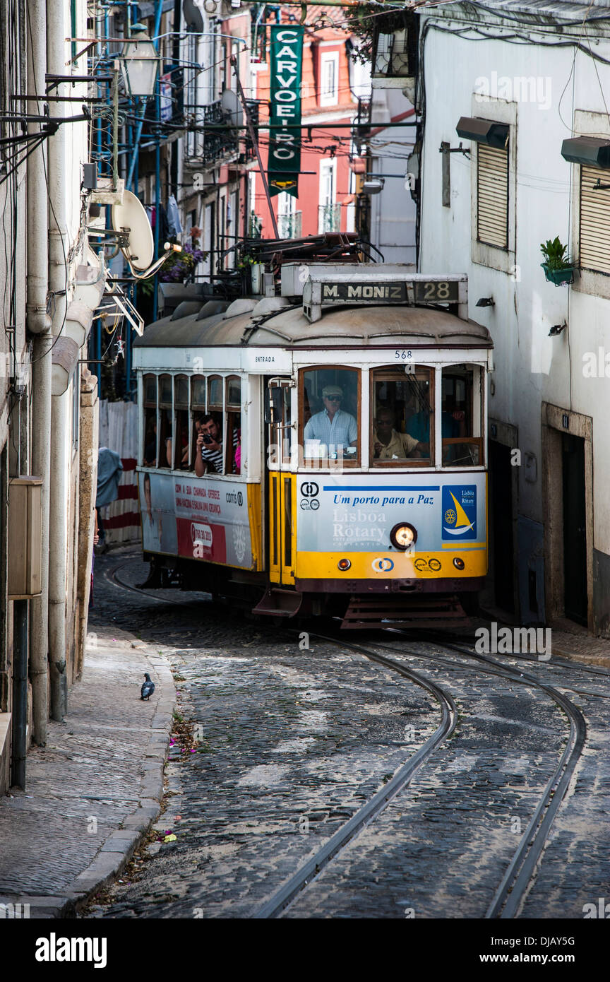 The famous tram 28 travelling through the old quarter, Alfama, Lisbon, Lisbon District, Portugal Stock Photo