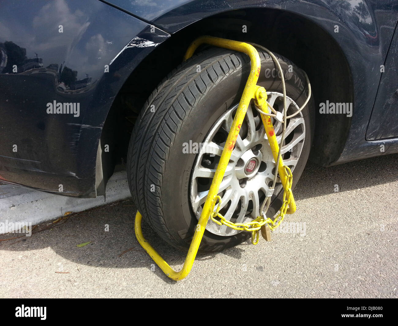 Car wheel clamped illegal parking hires stock photography and images