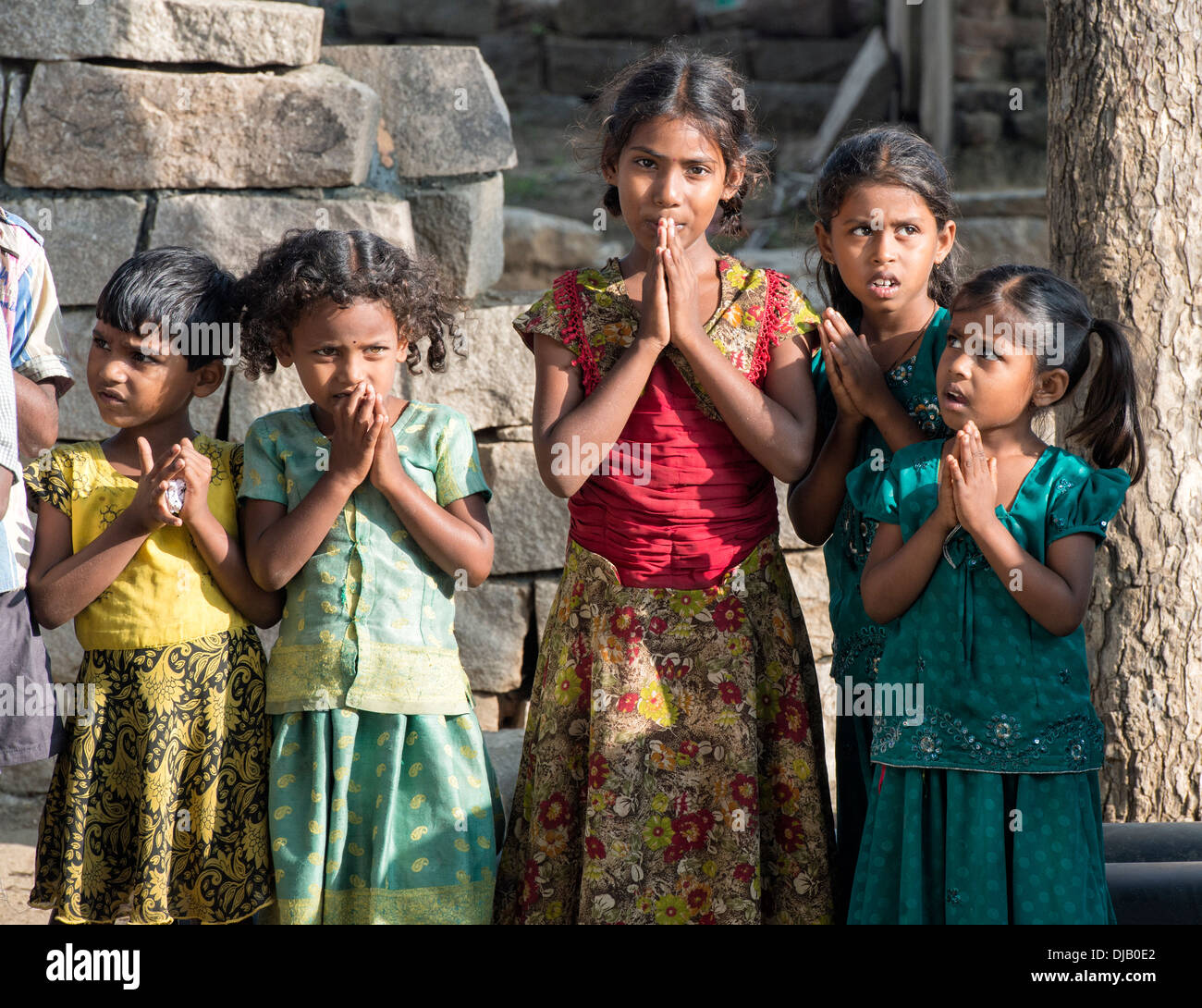 Rural Indian village school girls offering namasker. Andhra Pradesh, India Stock Photo