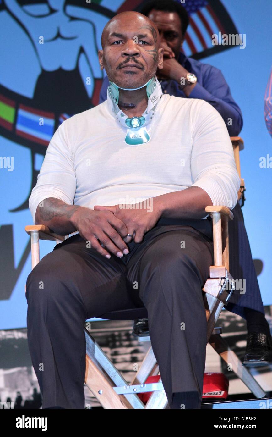 Mike Tyson at the press conference in a neck brace Boxing charity event  press conference, with 12 unique watches to commemorate 12 of the world's  greatest boxers to grace the ring, to