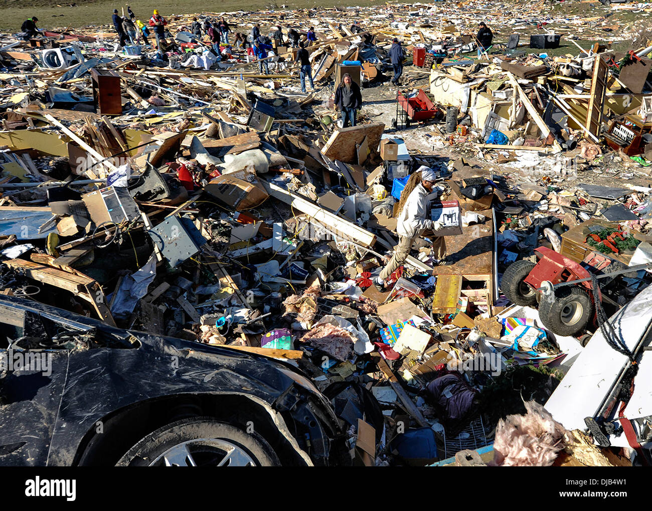 Residents recover items from their homes destroyed by an EF-4 tornado November 19, 2013 in Washington, IL. The tornado left a path of destruction that stretched for more than 46 miles and damaged fourteen-hundred homes. Stock Photo