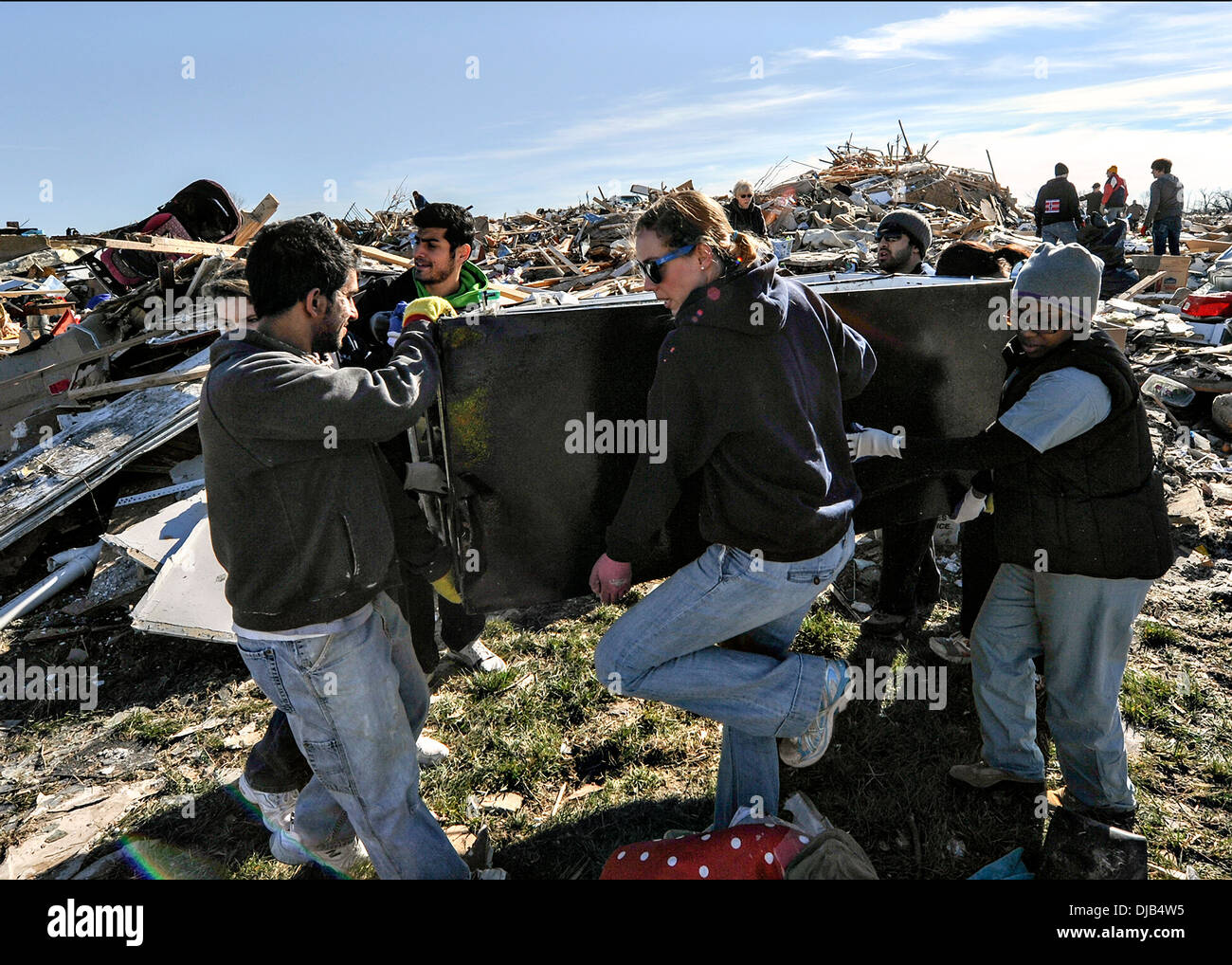Residents recover items from their homes destroyed by an EF-4 tornado November 19, 2013 in Washington, IL. The tornado left a path of destruction that stretched for more than 46 miles and damaged fourteen-hundred homes. Stock Photo