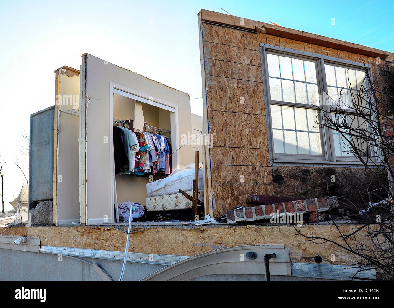A bedroom closet remains untouched as the rest of the home was destroyed by an EF-4 tornado in the aftermath November 19, 2013 in Washington, IL. The tornado left a path of destruction that stretched for more than 46 miles and damaged fourteen-hundred homes. Stock Photo