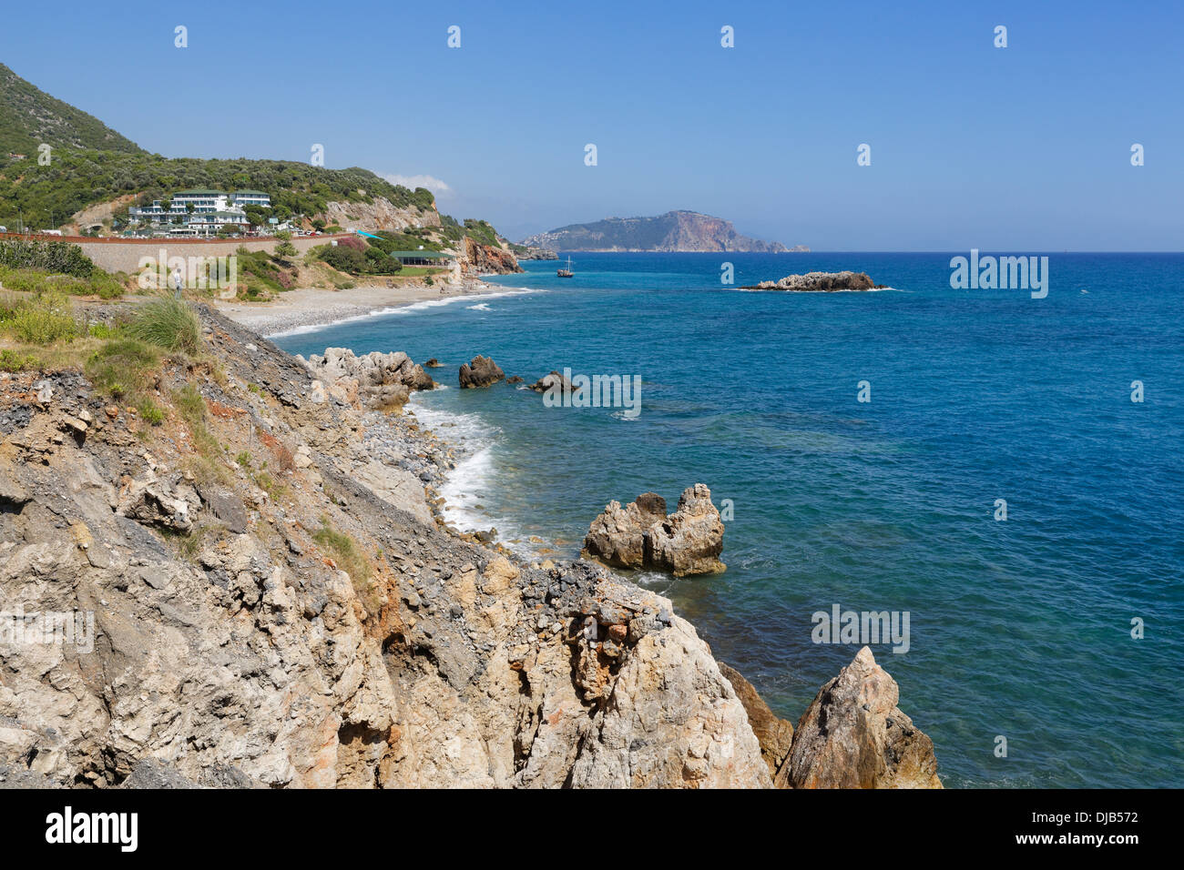 Coast west of Alanya, Turkish Riviera, in the back the castle hill of Alanya, Antalya Province, Turkey Stock Photo