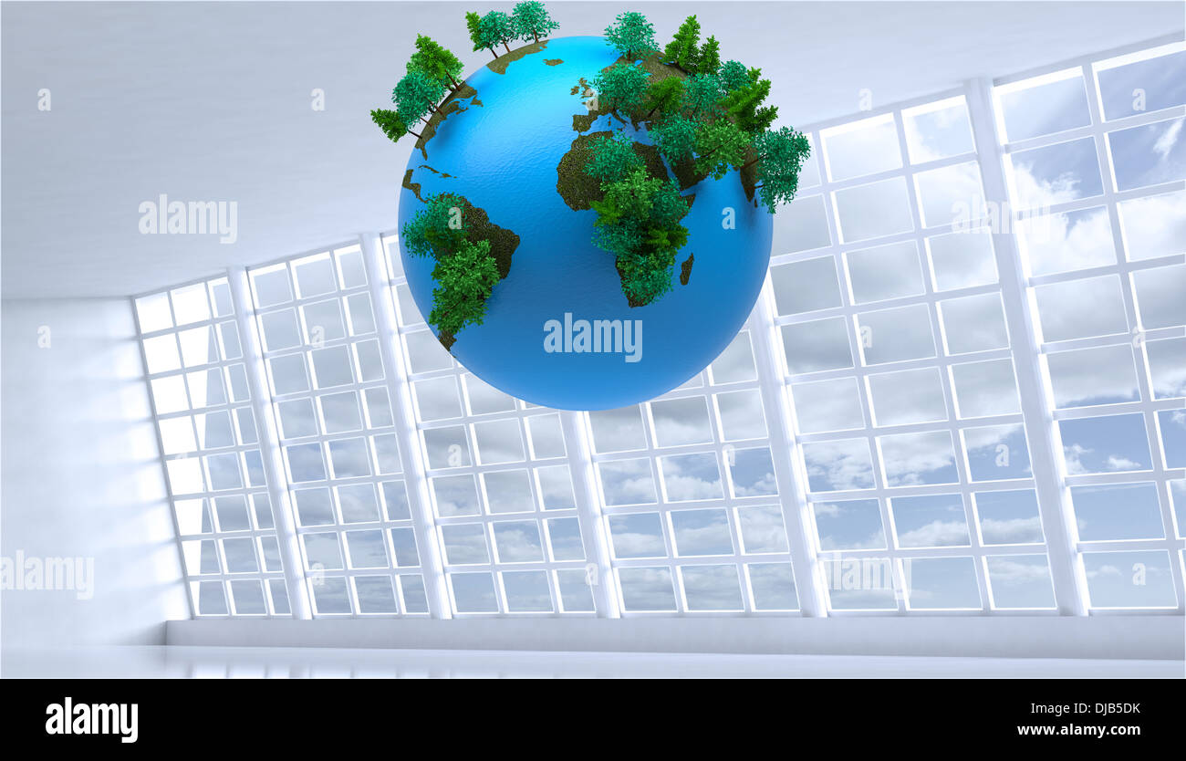 Globe floating in room Stock Photo