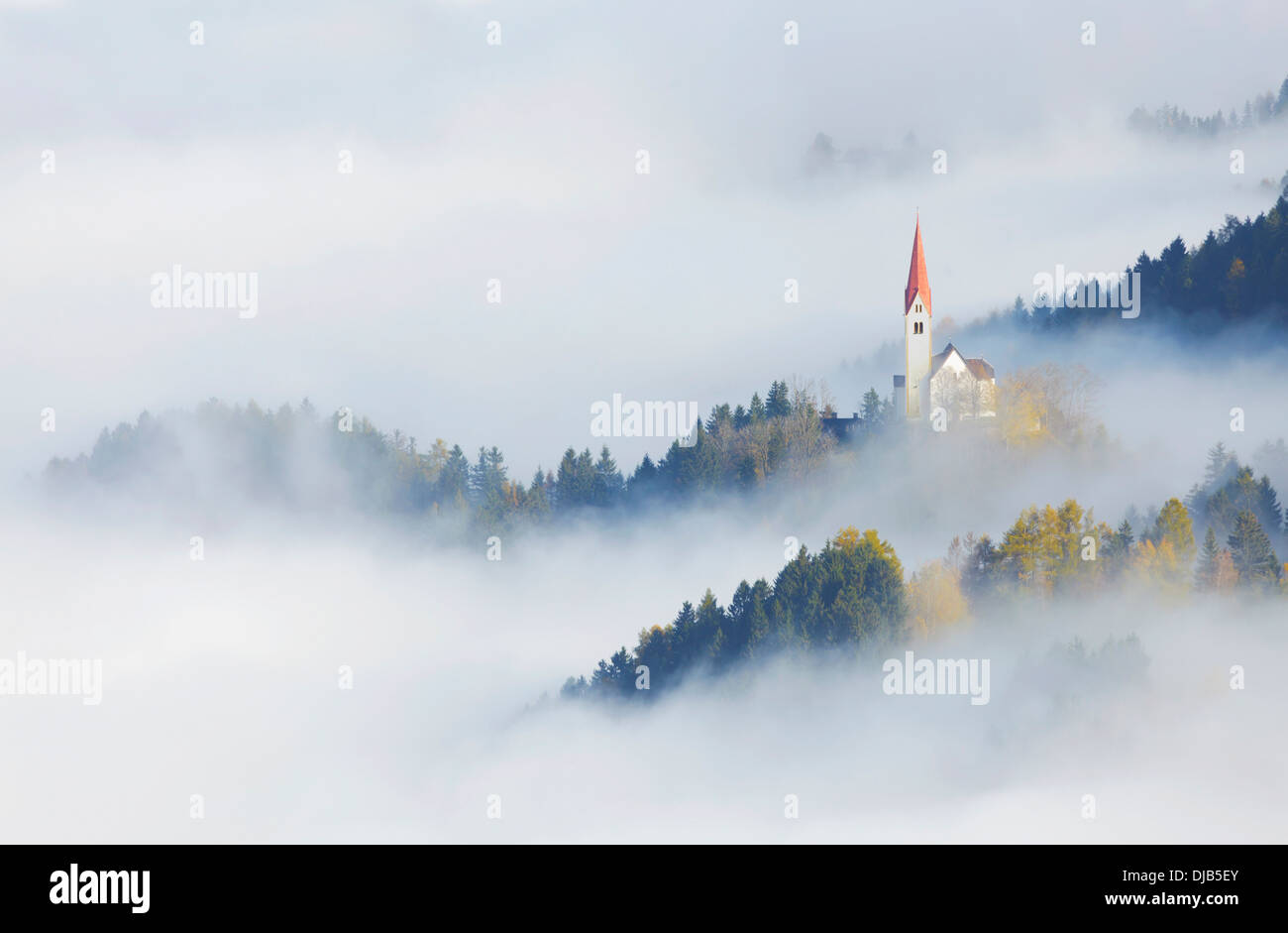 The Church of St. Peter in the fog, Weerberg, Tyrol, Austria Stock Photo