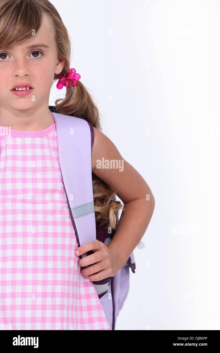 Little girl carrying backpack Stock Photo Alamy