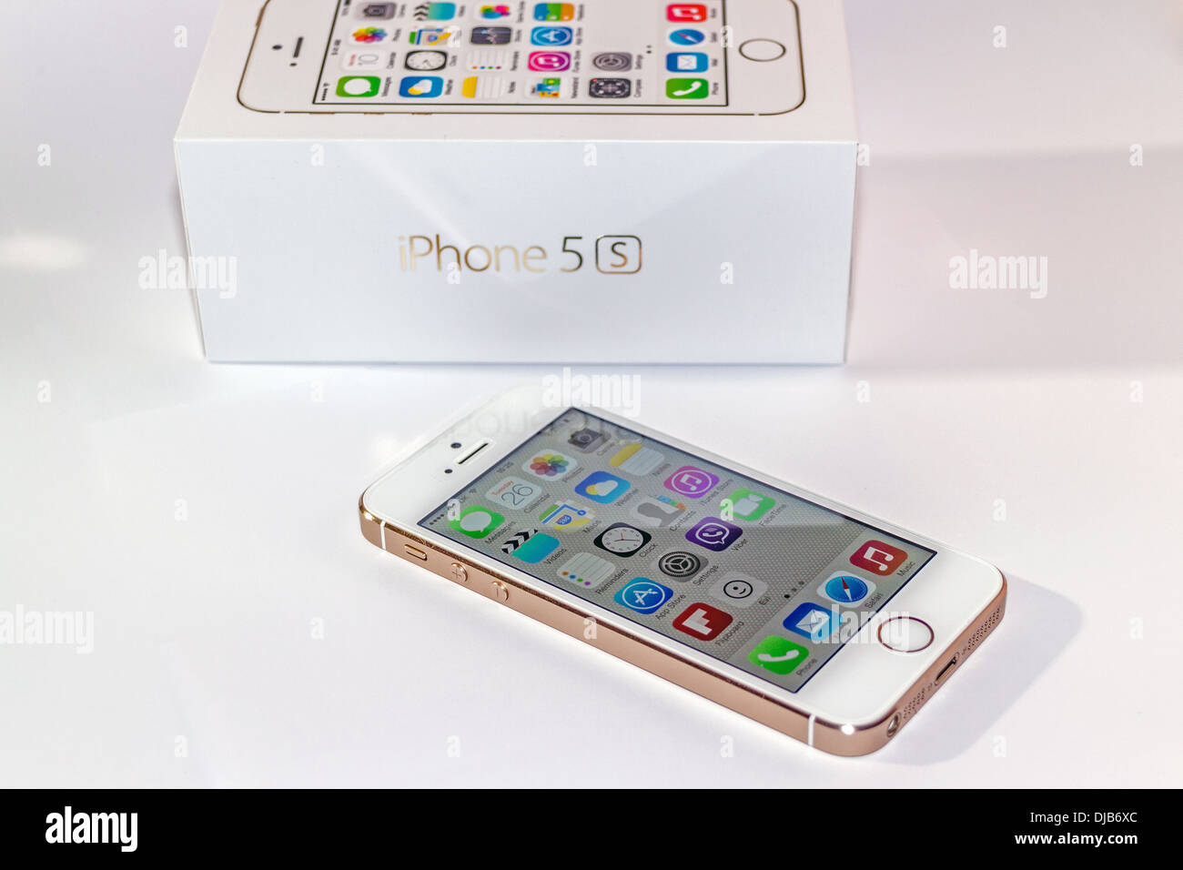 iPhone 5s Gold Next To Box Face Up Stock Photo