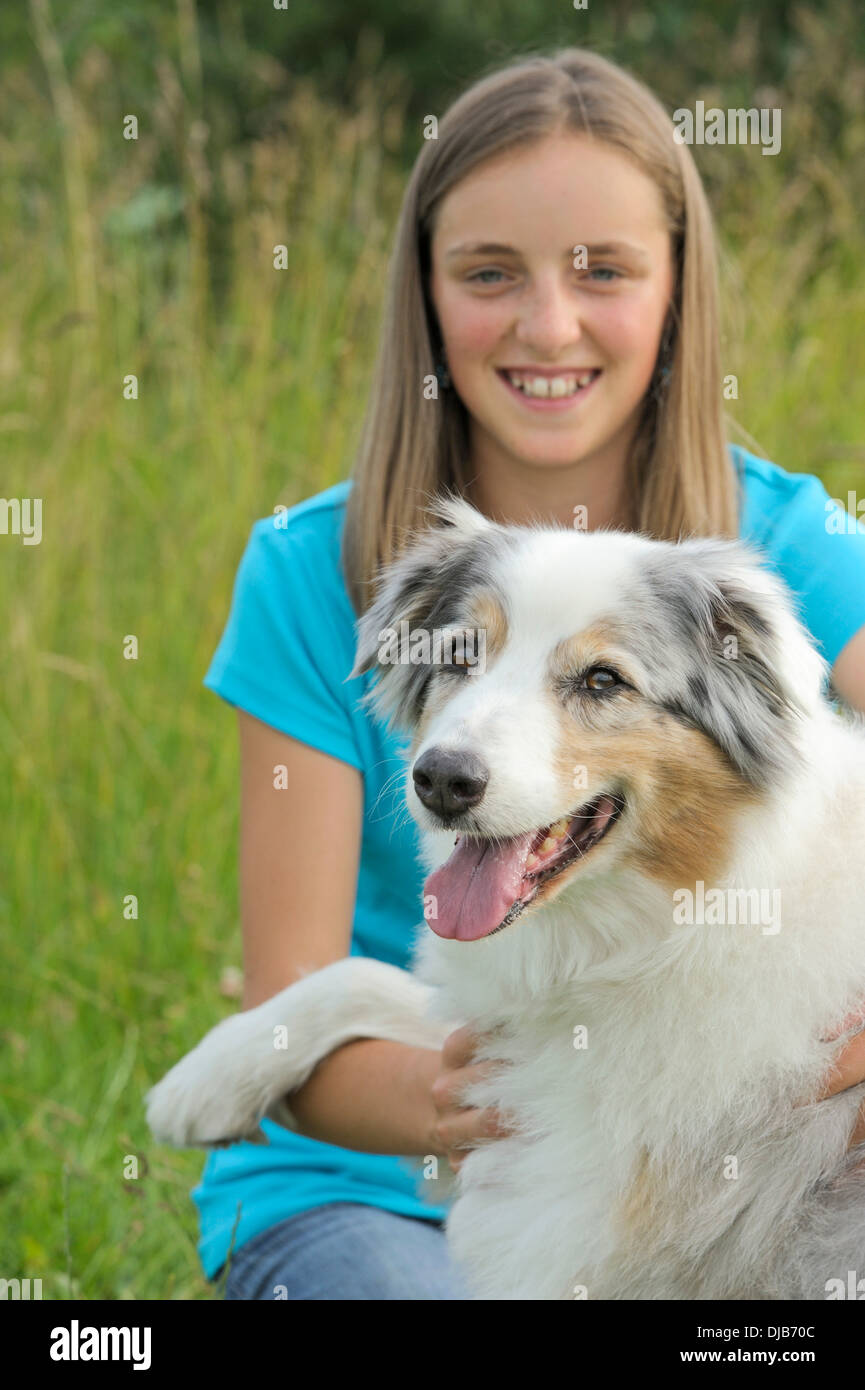 Girl and her Australian Shepherd dog Stock Photo