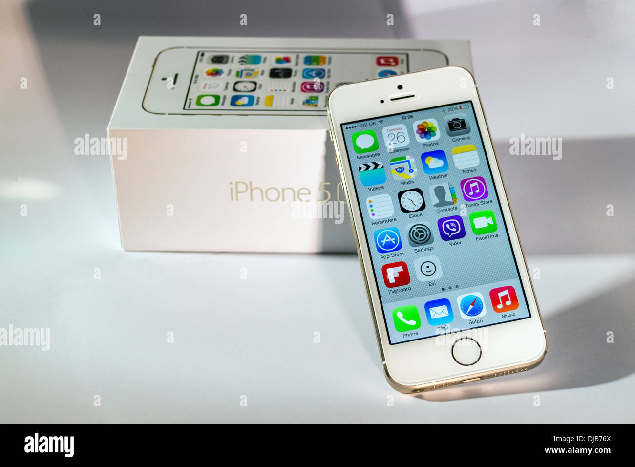 iPhone 5s Gold Front View Slanted on Box With Shadows Stock Photo