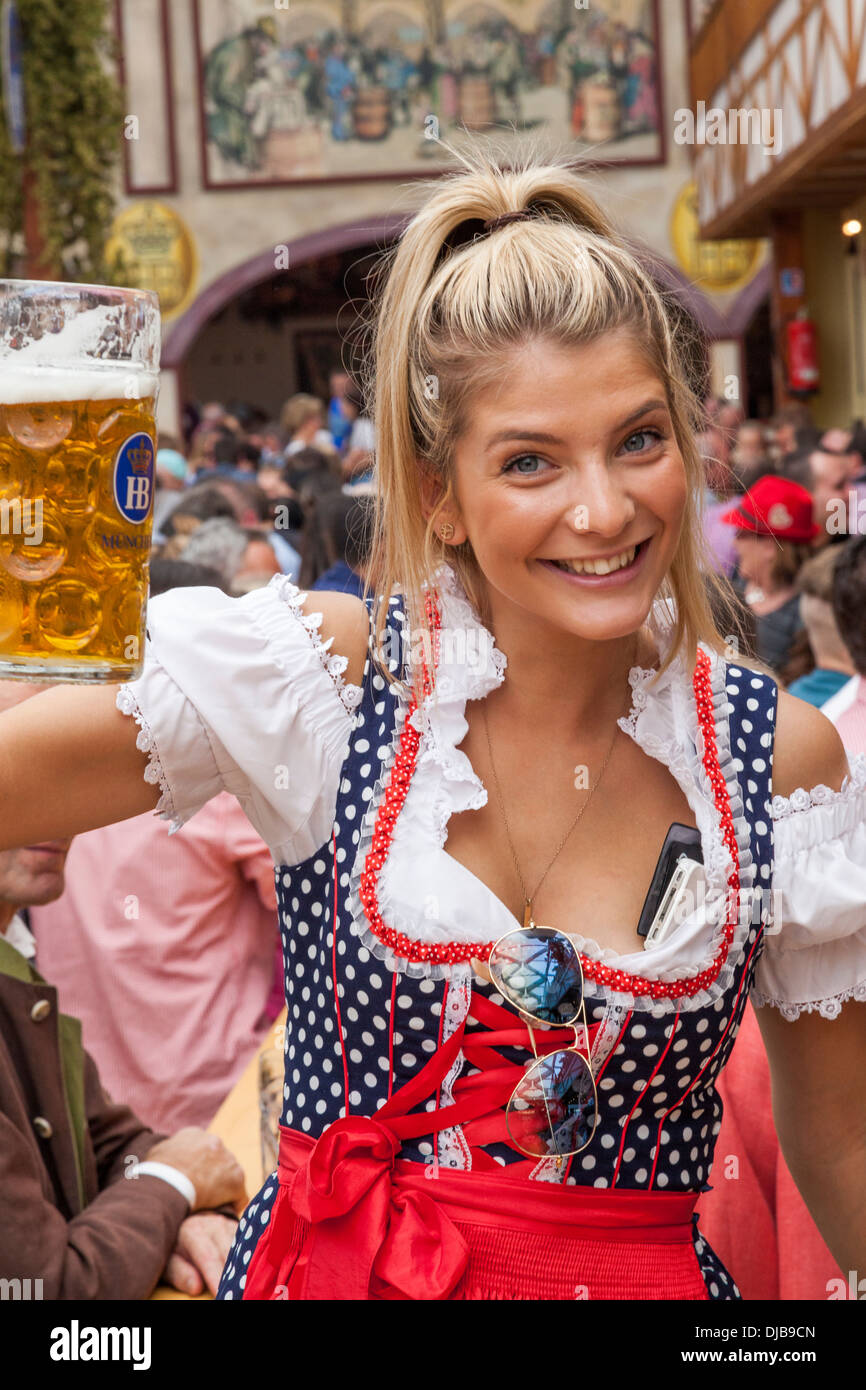 Germany, Bavaria, Munich, Oktoberfest, Young Woman Drinking Beer Stock ...