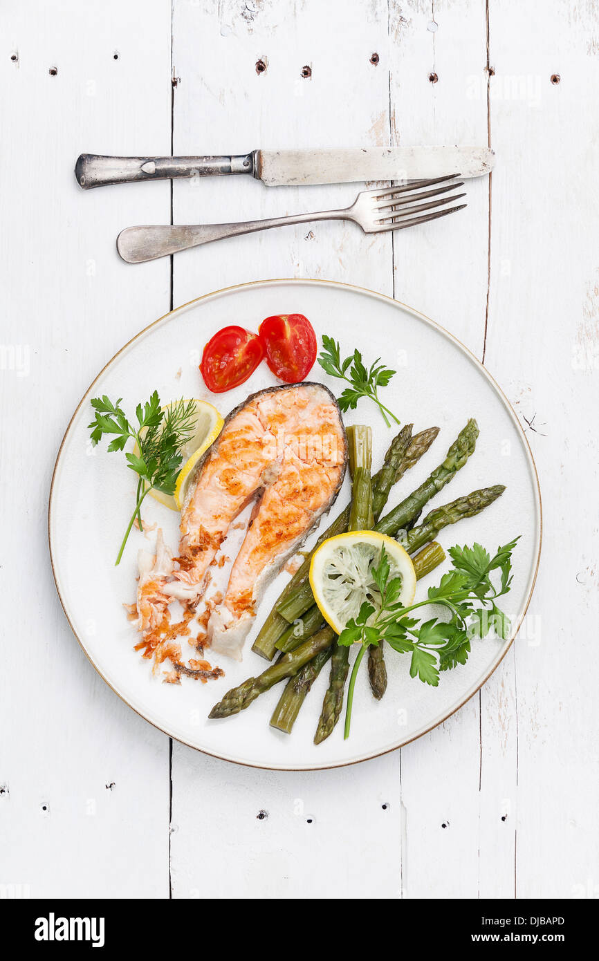 Grilled salmon with asparagus on white plate Stock Photo
