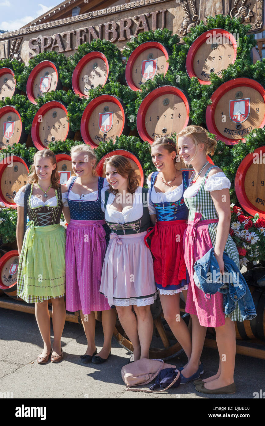 Germany Bavaria Munich Oktoberfest Girls Dressed In Bavarian Costume Posing In Front Of Beer 