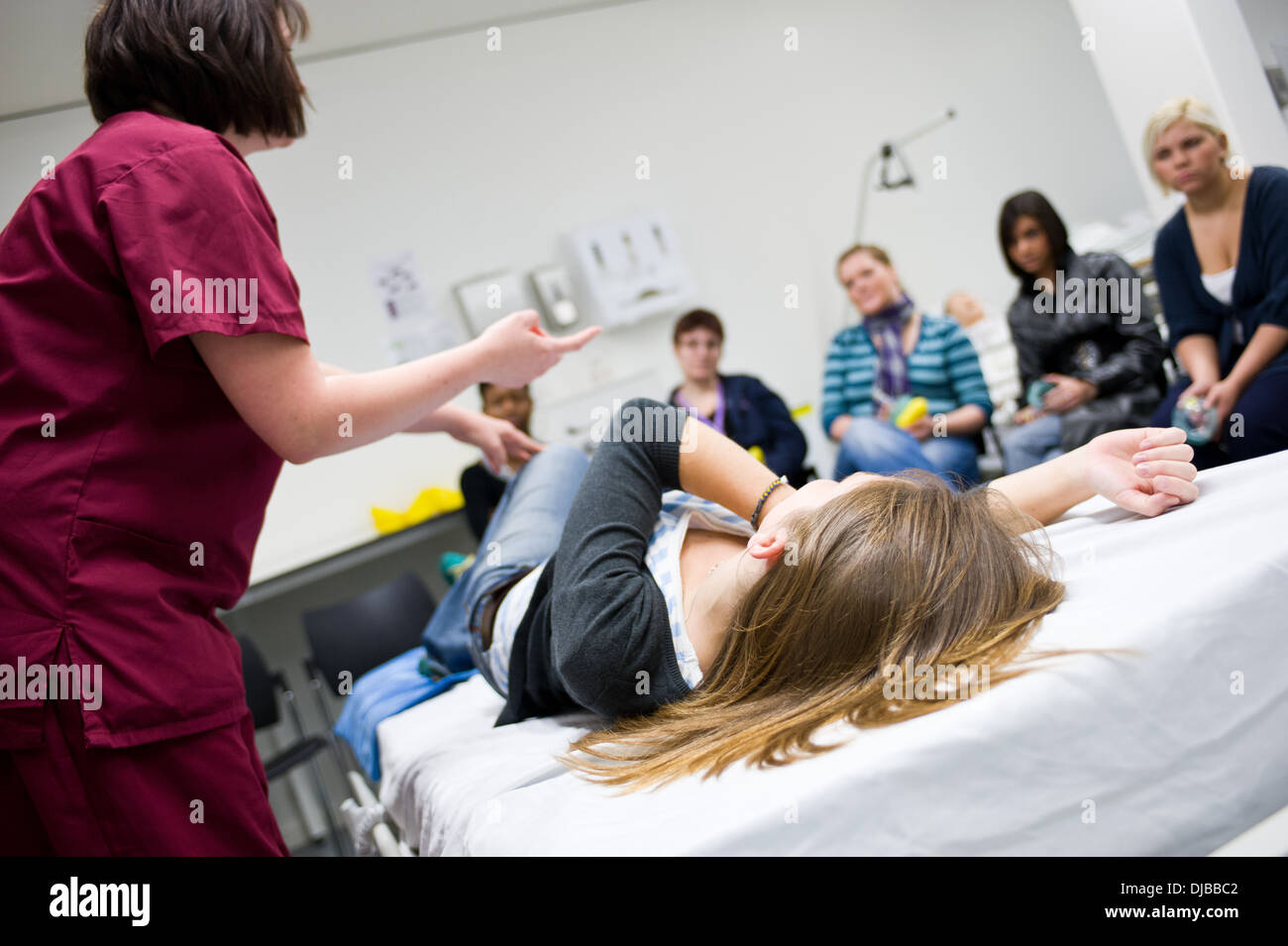 nursing students being taught by nurse instructor in clinical skills lab Stock Photo