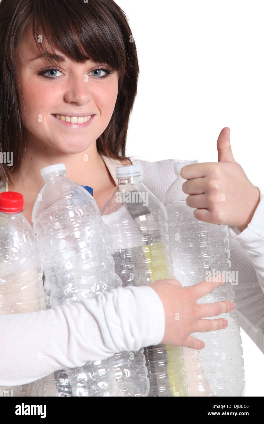 Woman recycling plastic bottles Stock Photo Alamy