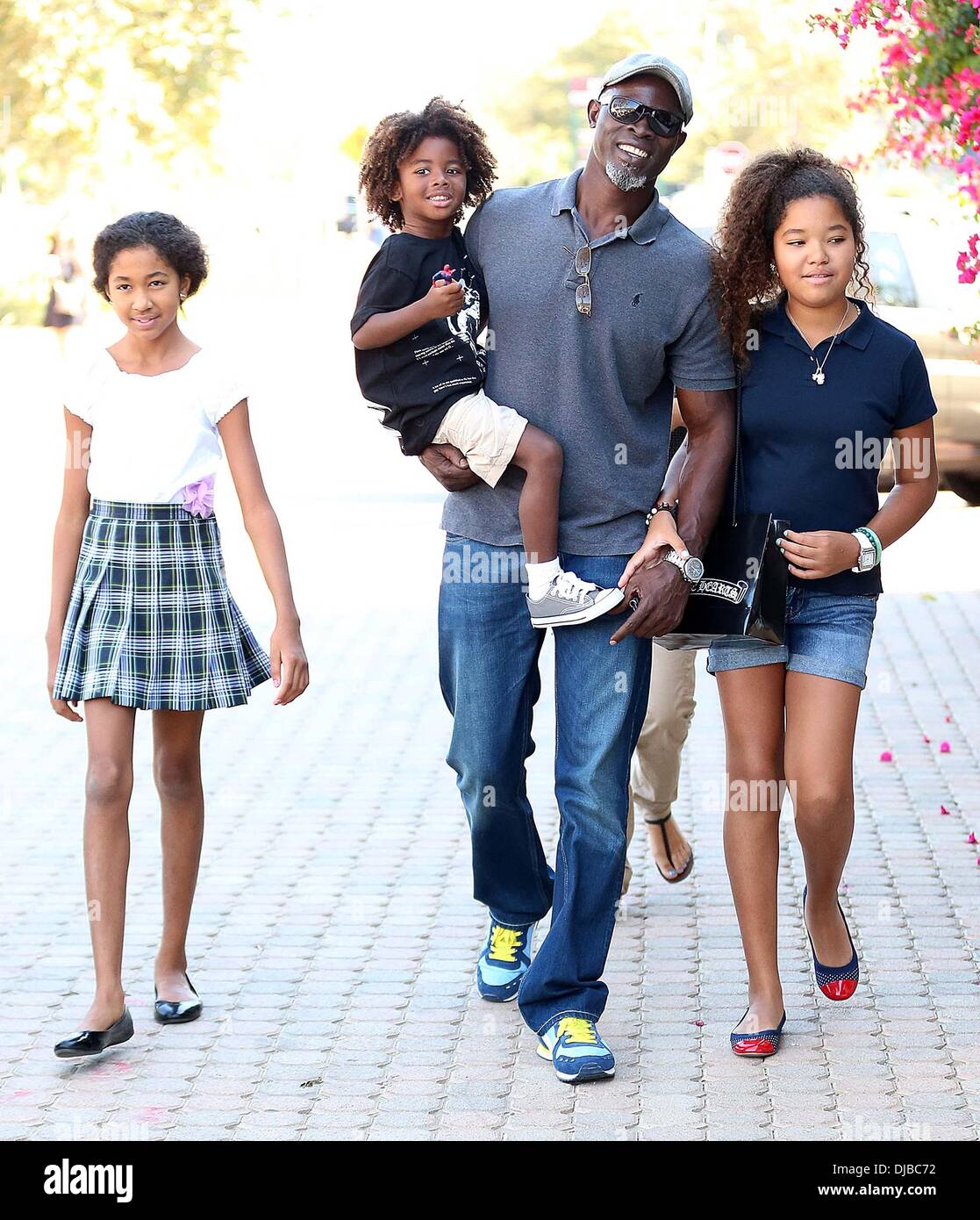 Kenzo Lee Hounsou, Djimon Hounsou, Ming Lee Simmons and Aoki Lee Simmons Djimon Hounsou at the Malibu Country Mart with his stepdaughters and son Los Angeles, California - 15.09.12 Stock Photo