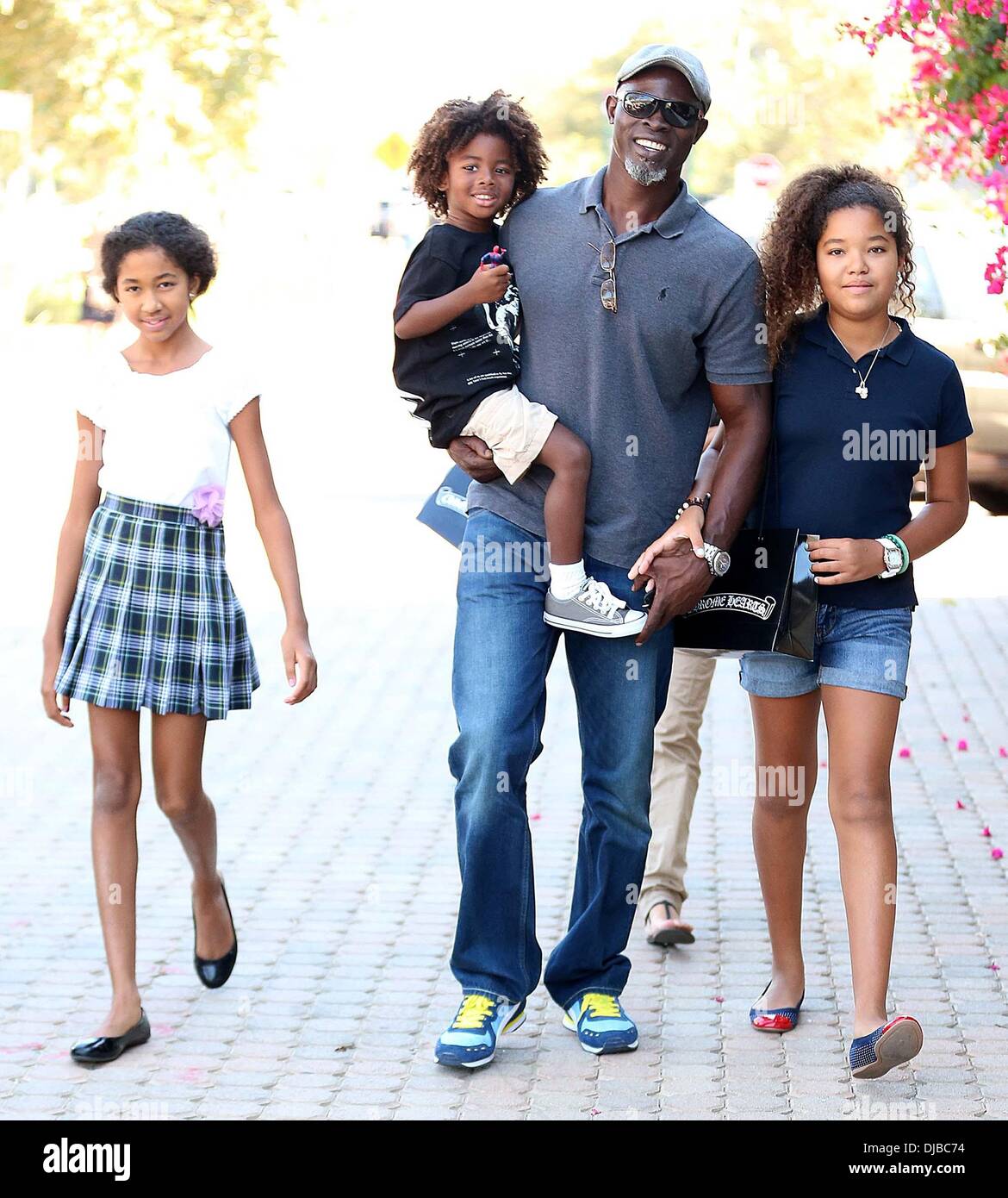 Kenzo Lee Hounsou, Djimon Hounsou, Ming Lee Simmons and Aoki Lee Simmons Djimon Hounsou at the Malibu Country Mart with his stepdaughters and son Los Angeles, California - 15.09.12 Stock Photo