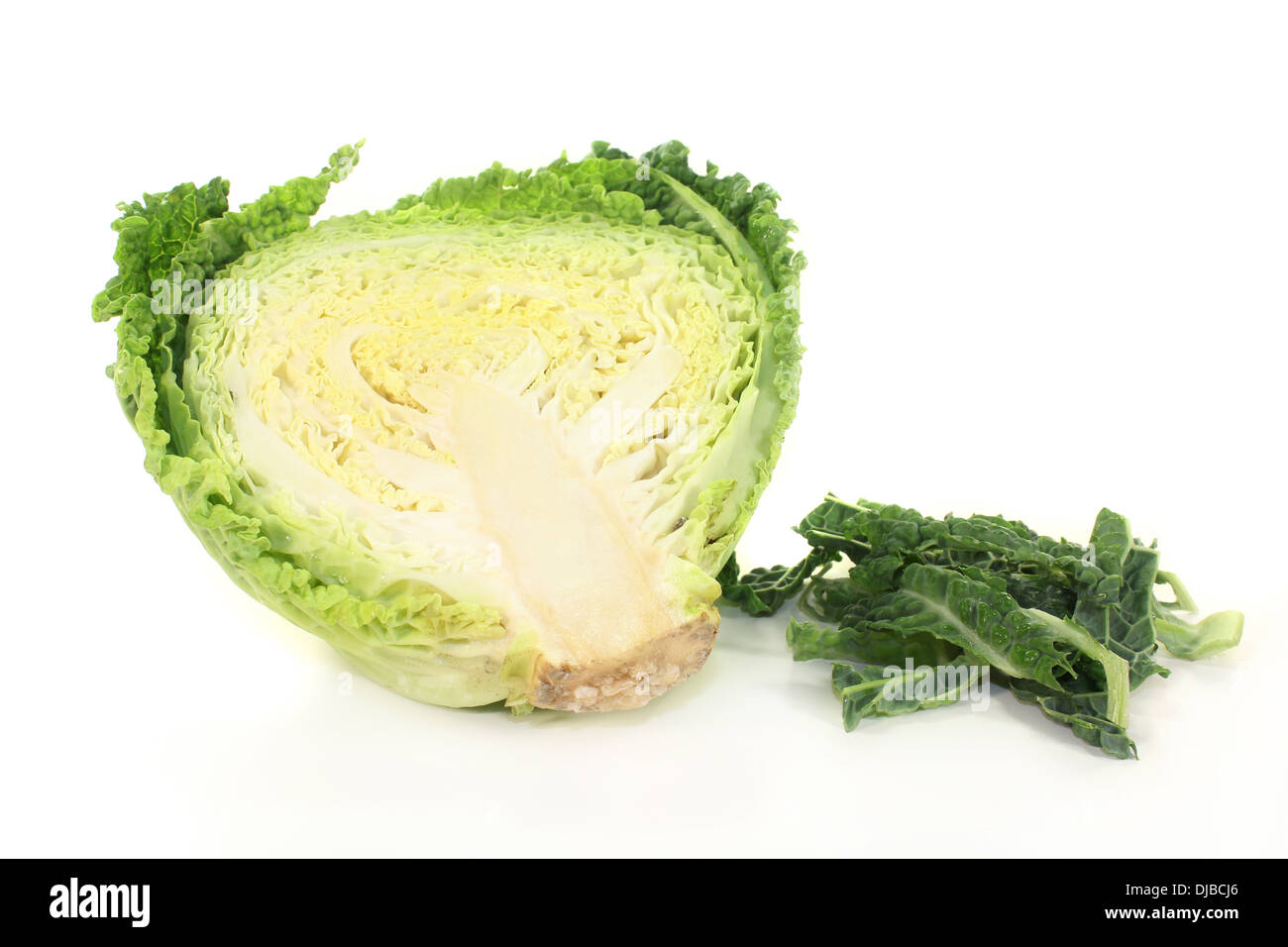 a sliced savoy cabbage against white background Stock Photo