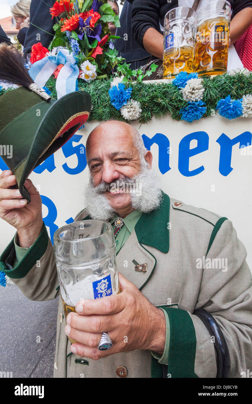Germany, Bavaria, Munich, Oktoberfest Parade, Character in Costume Holding Beer Glass Stock Photo