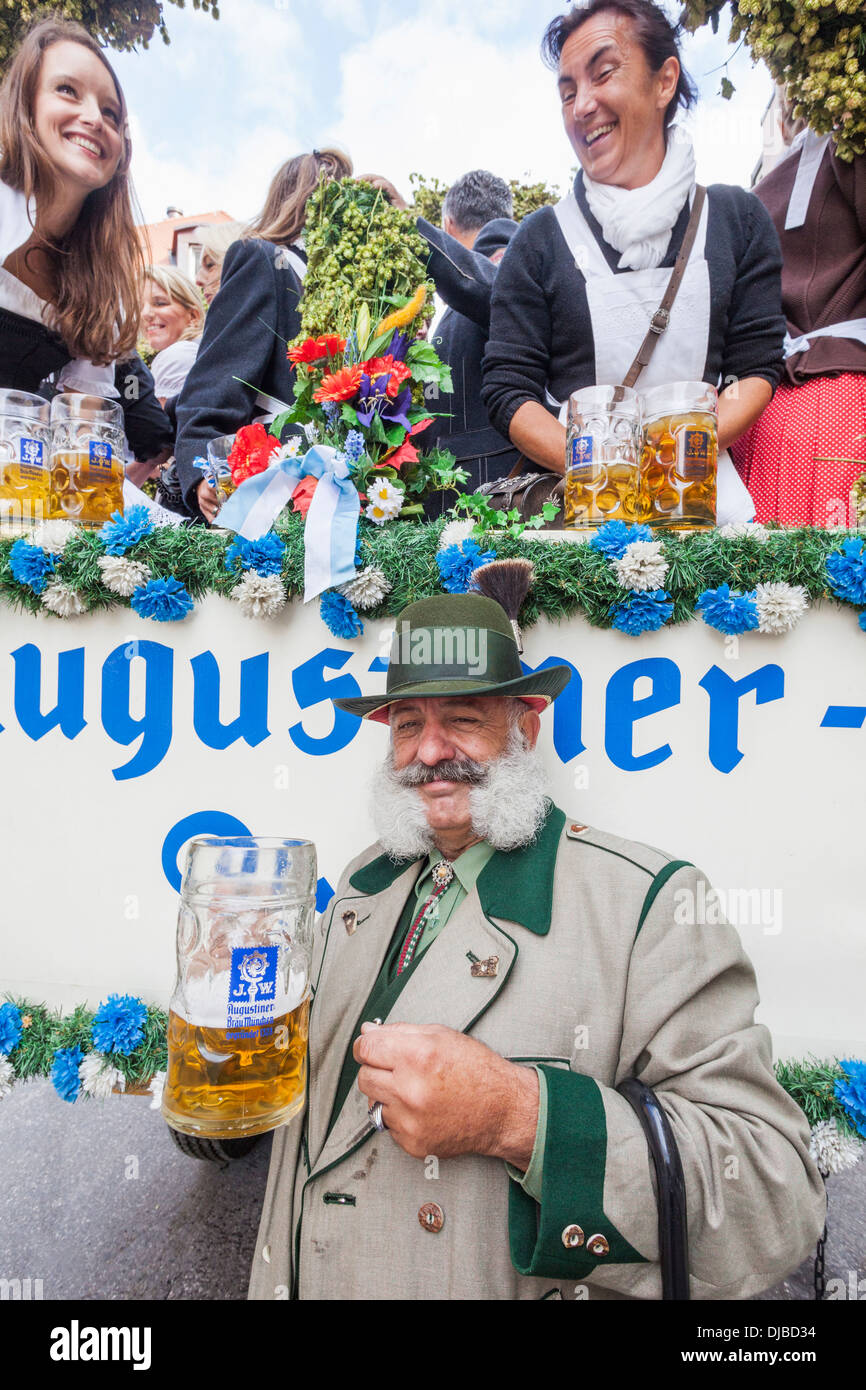 Germany, Bavaria, Munich, Oktoberfest Parade, Character in Costume Holding Beer Glass Stock Photo