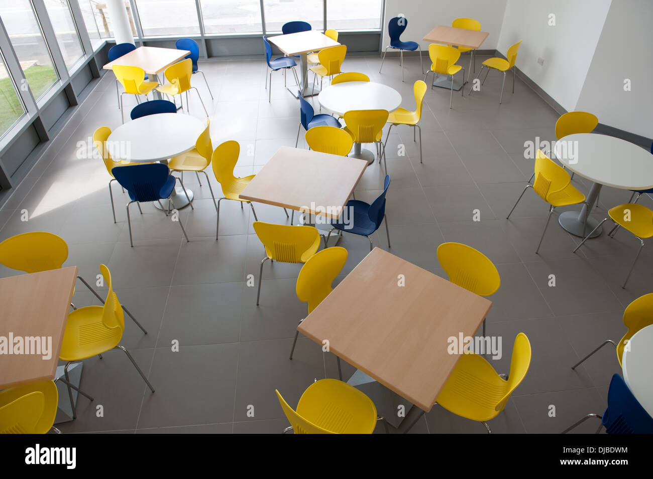 Modern cafe seating area tables school college canteen Stock Photo Alamy