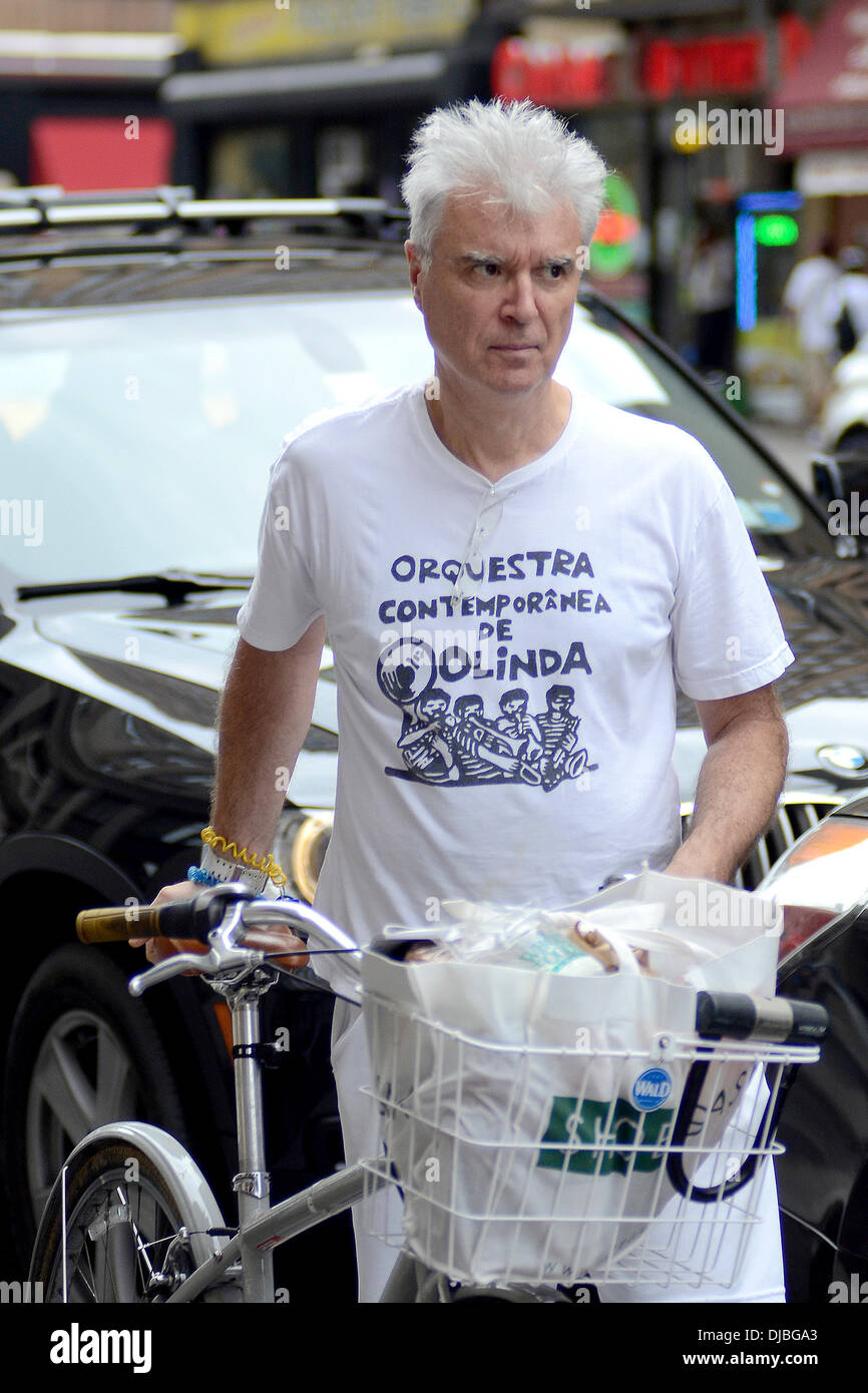David Byrne Former Talking Heads frontman returns to his bicycle with groceries, after shopping at Whole Foods Market New York City, USA - 02.09.12 Stock Photo