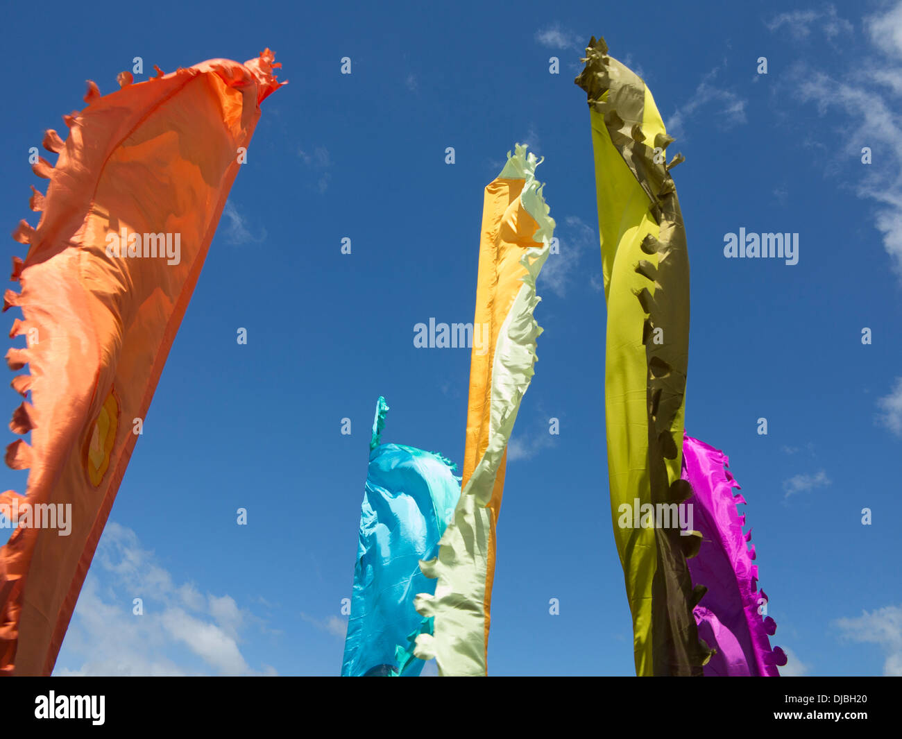 Brightly Coloured flags against Blue Sky Stock Photo