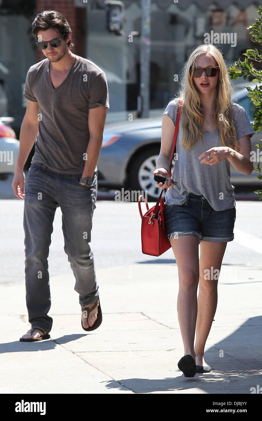 Actress Amanda Seyfried seen out with a male companion. Los Angeles, California- 04.09.12 Stock Photo