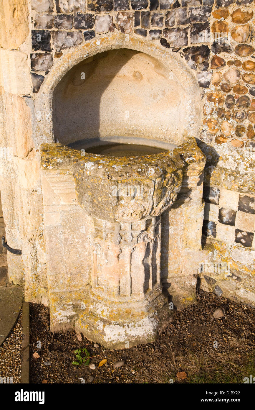 Holy water font outside Holy Trinity church Blythburgh, Suffolk, England Stock Photo