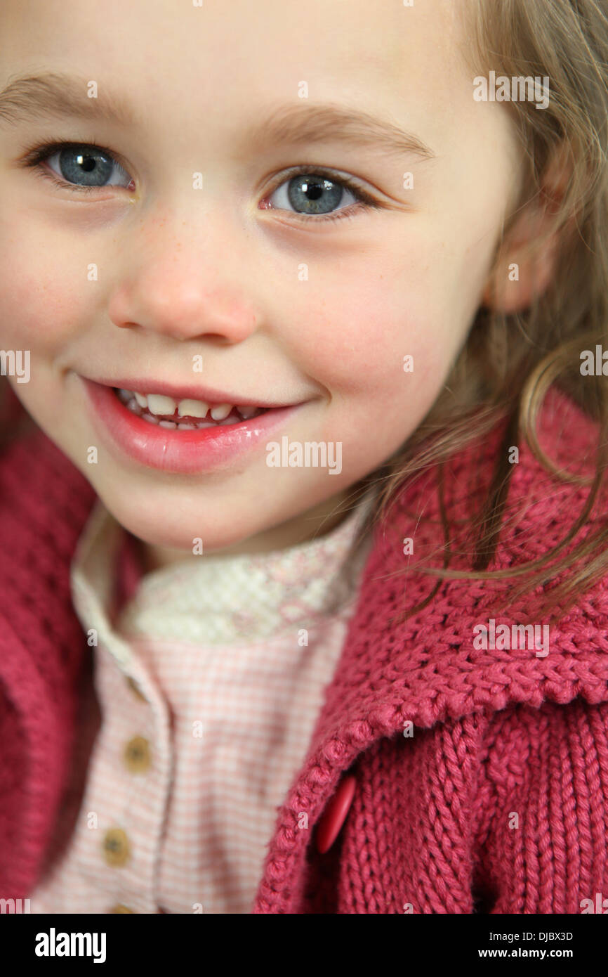Little girl wearing pink cardigan Stock Photo Alamy
