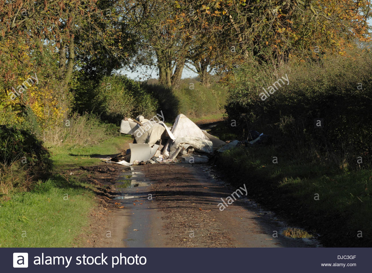 Country Lane Blocked By Fly Tipping Rubbish, Staffordshire, England, UK Stock Photo