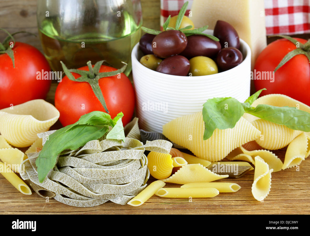 still life of Italian foods (olive, oil, pasta, cheese) Stock Photo