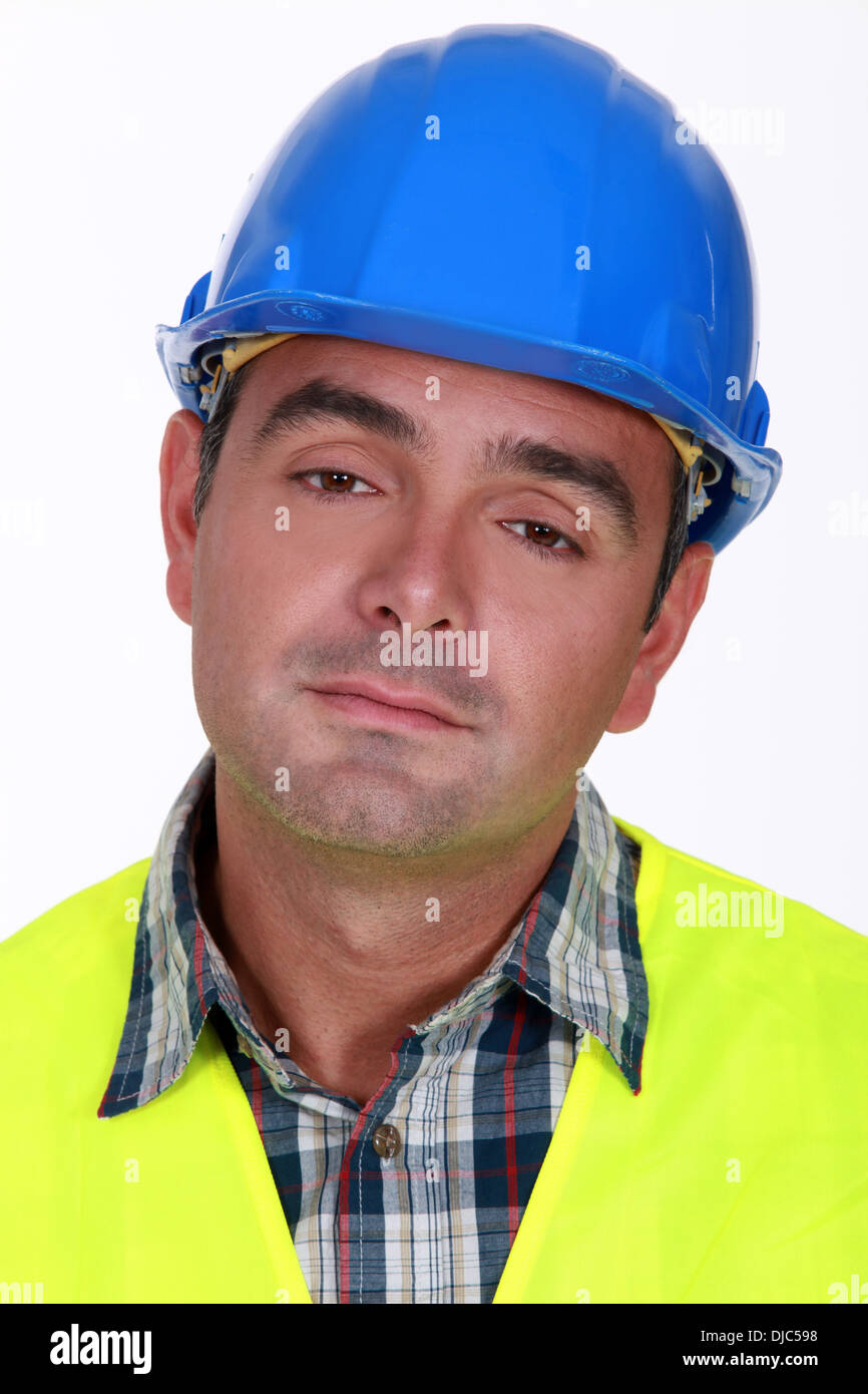 Portrait of bored laborer Stock Photo - Alamy