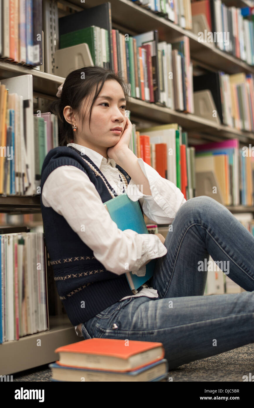 Sad asian girl books hi-res stock photography and images - Alamy