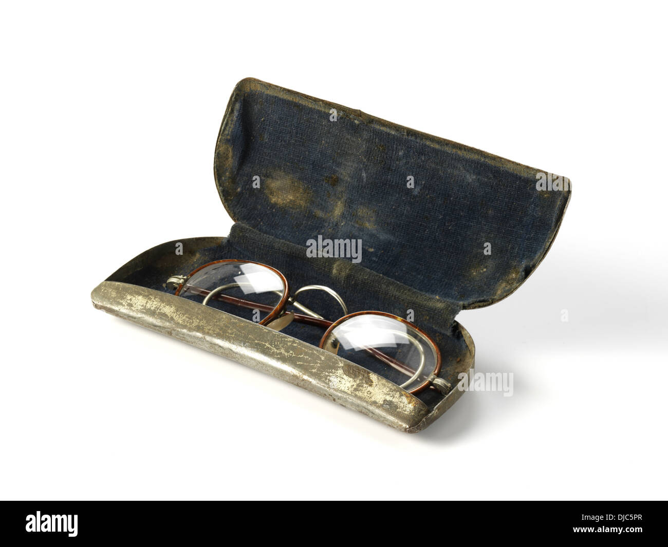 Pair of old fashioned glasses with wire frames in a metal case Stock Photo