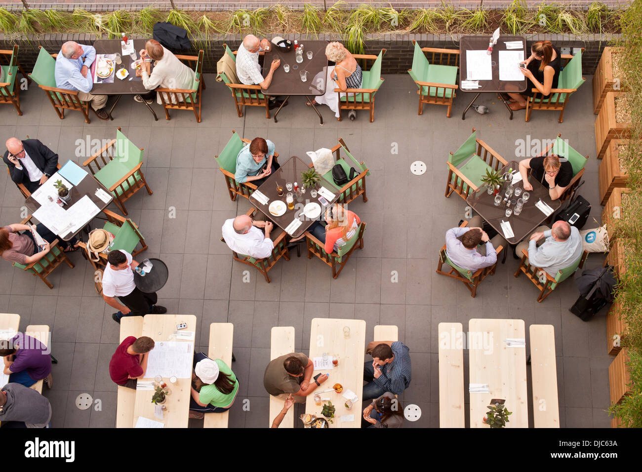 Overhead view of people at a restaurant on the south bank of the Thames in London, England. Stock Photo