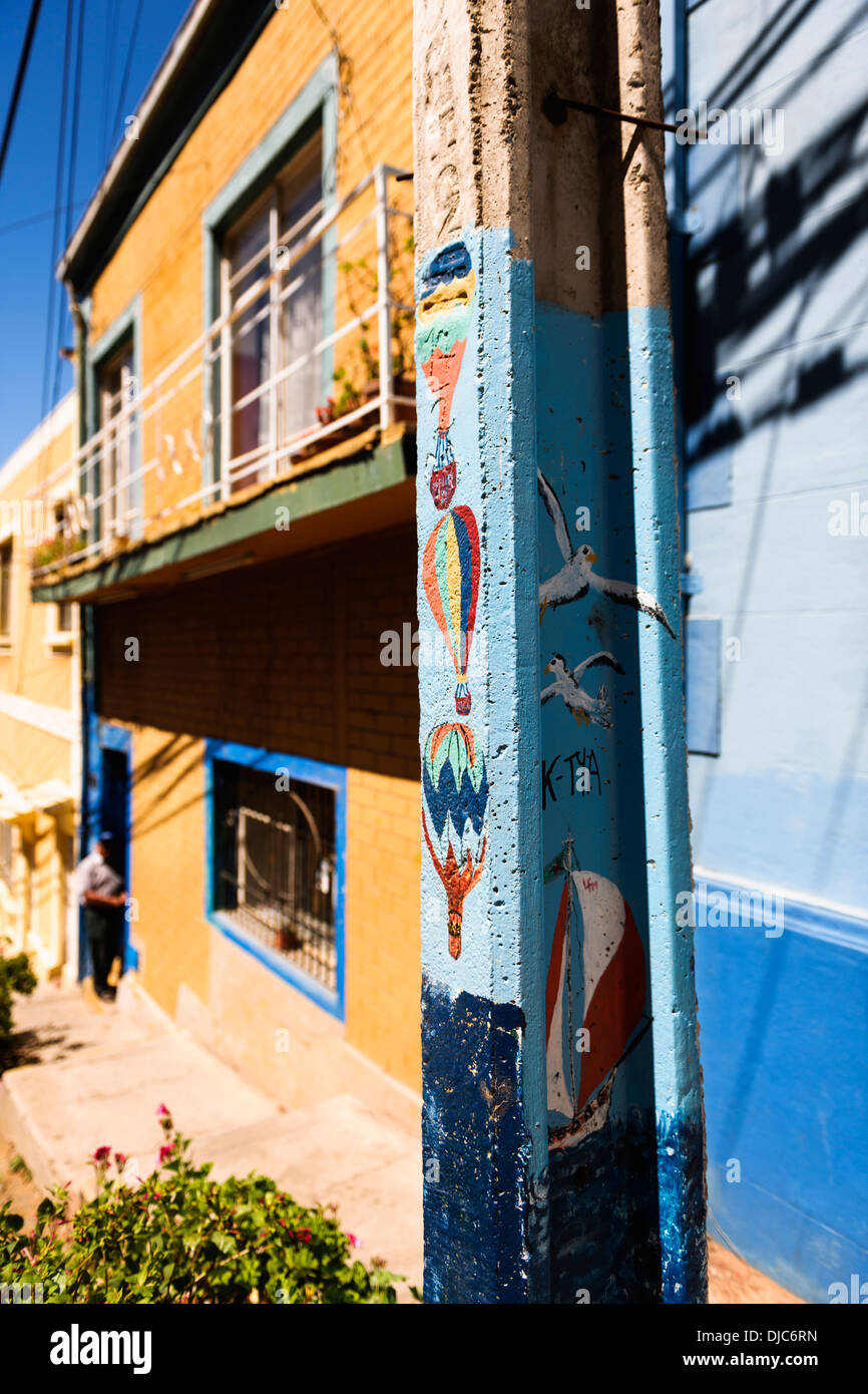 Street Art paintings of hot air balloons on a lamppost in Valparaiso