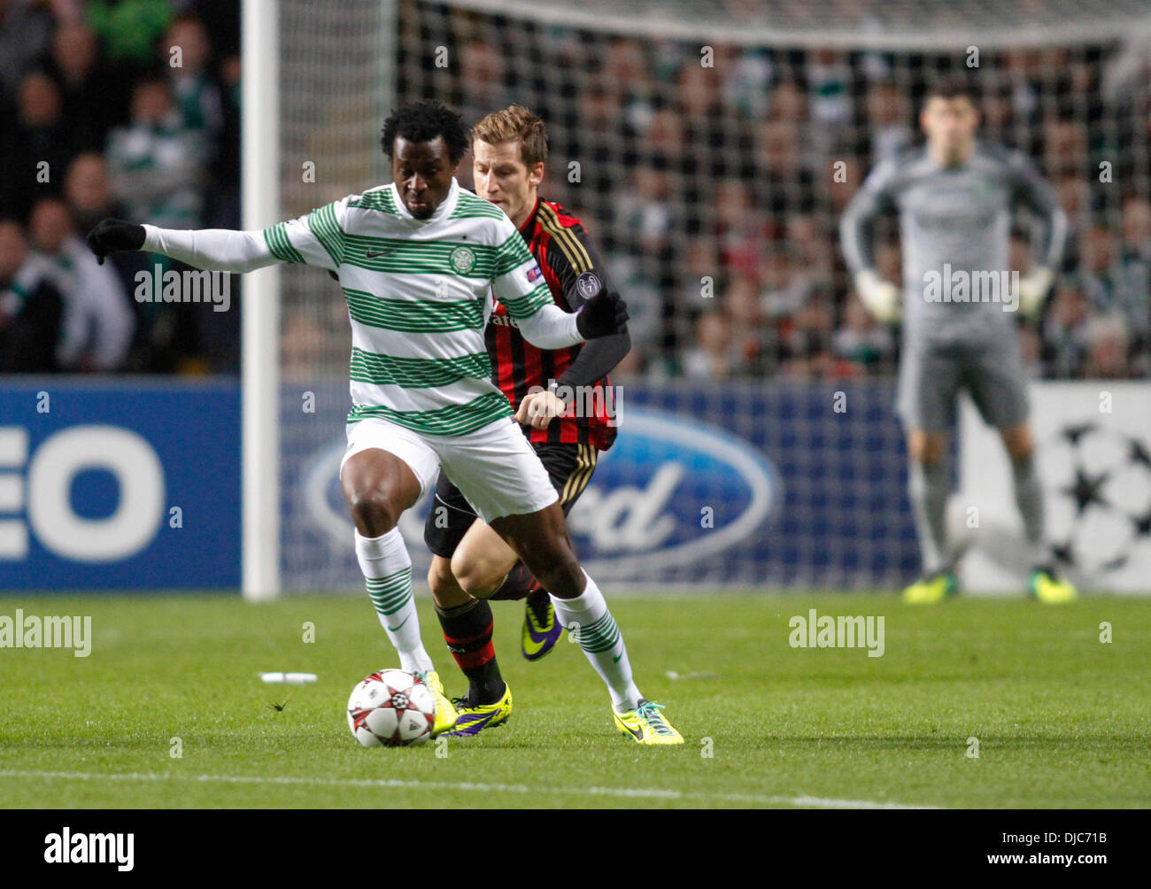 Glasgow, Scotland. 26th Nov, 2013. Valter Birsa tracks Efe Ambrose during the Champions League game between Celtic and AC Milan from Celtic Park. Credit:  Action Plus Sports/Alamy Live News Stock Photo