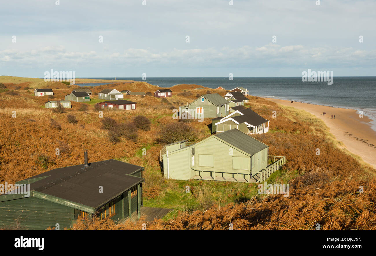 Chalets built in the sand dunes at Low Newton by the Sea on northumberlands coast, UK Stock