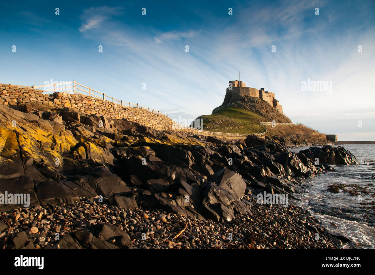 Holy Island and the castle that defended the harbour Lindisfarne Castle Stock Photo