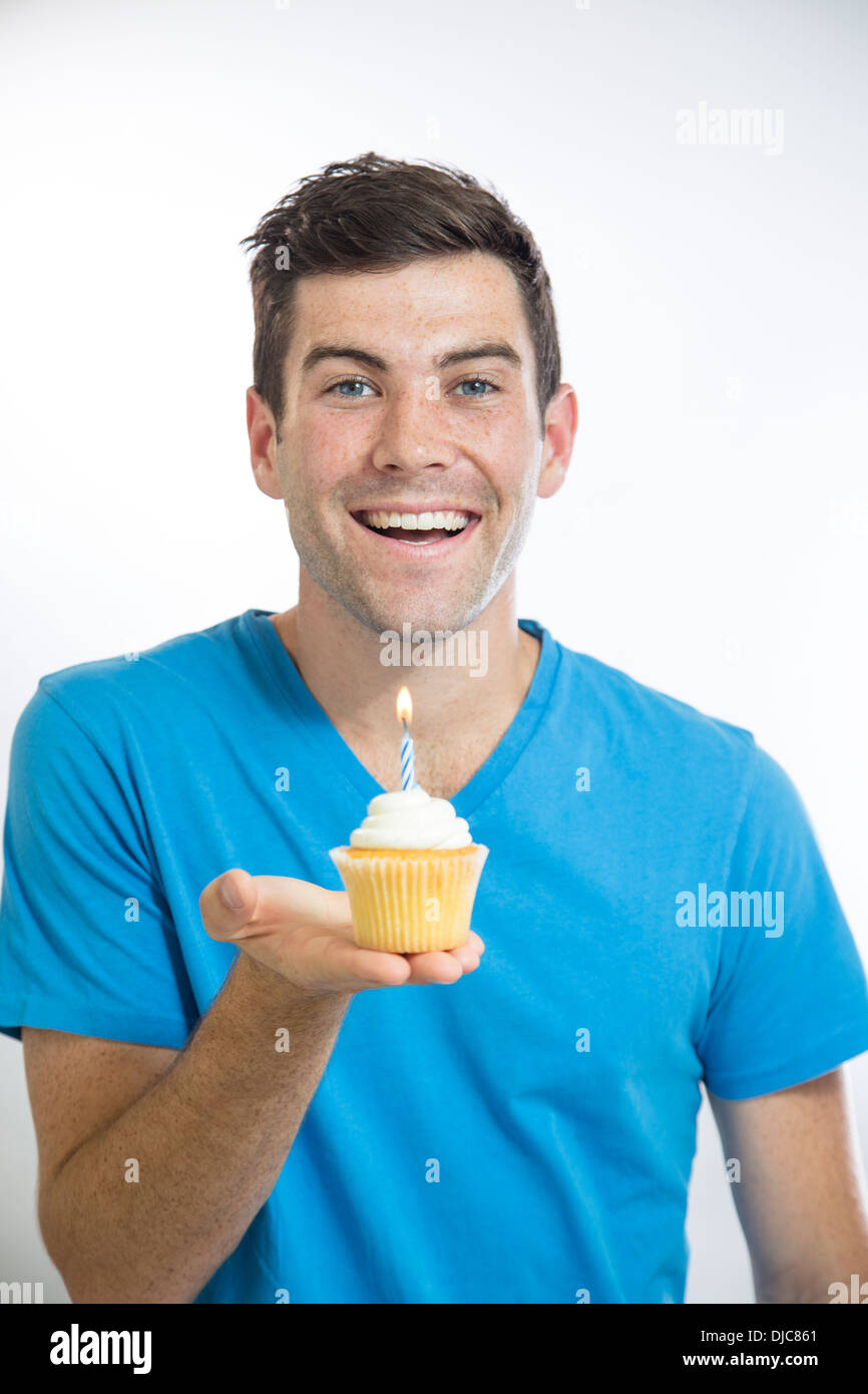 Man holding cupcake Stock Photo - Alamy