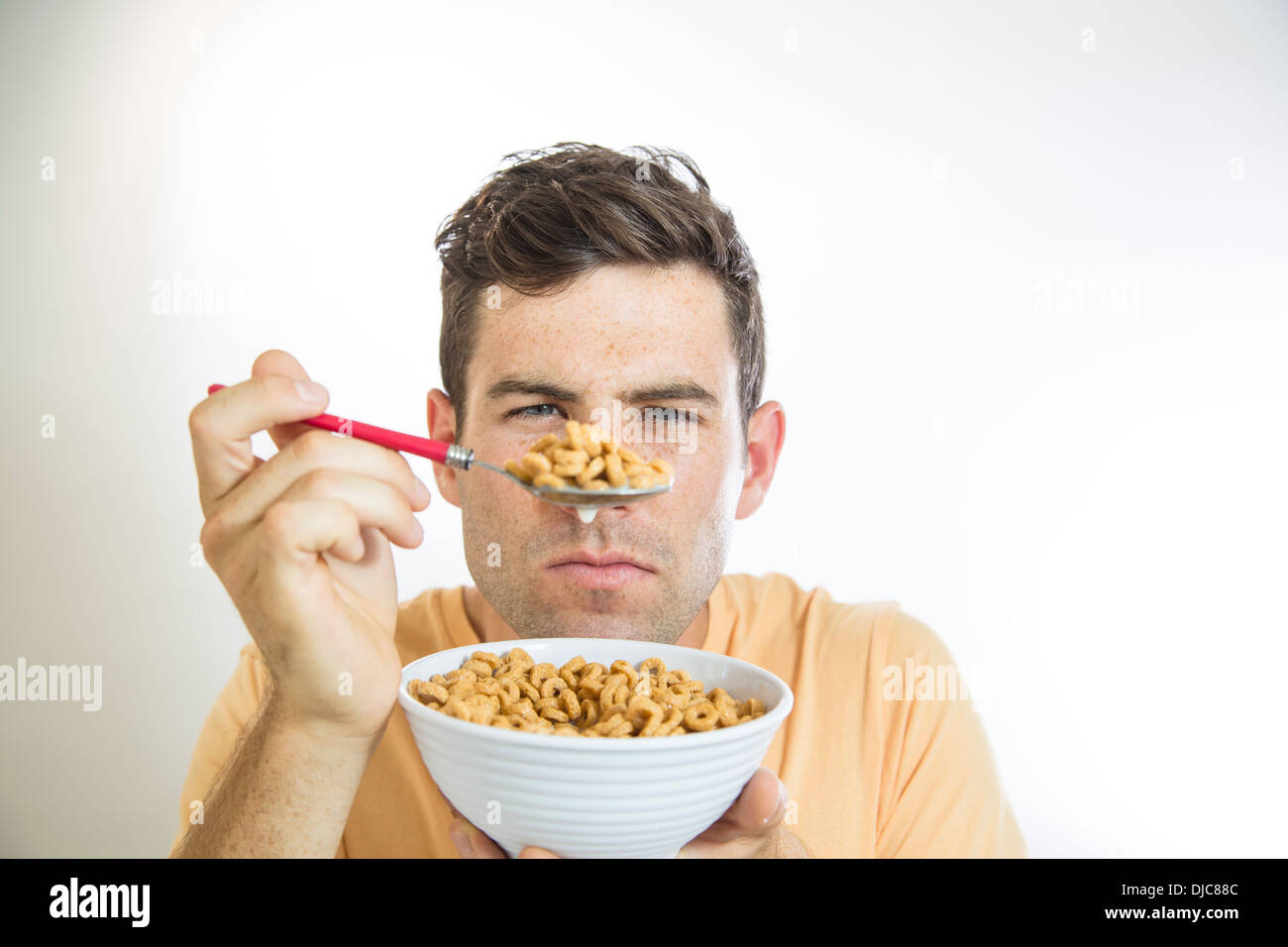 Man eating cereal Stock Photo