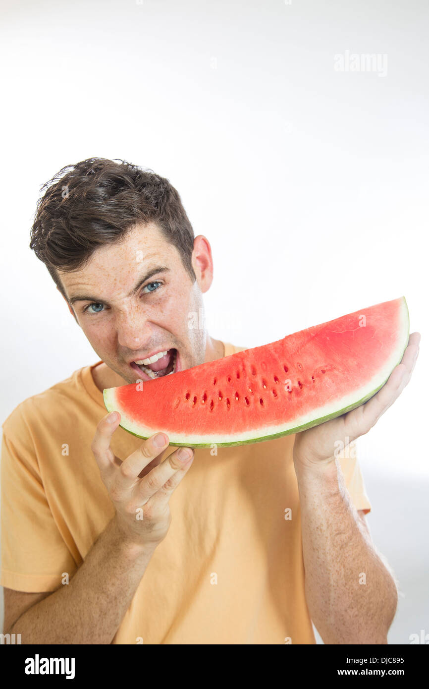 Man eating watermelon Stock Photo