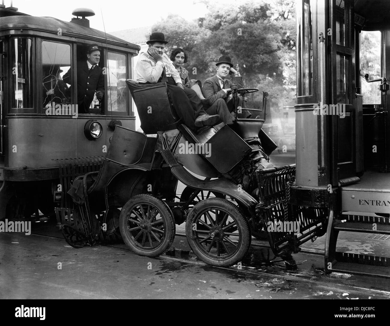 Oliver Hardy, Fay Holderness and Stan Laurel on-set of the Film, Hog Wild, 1930 Stock Photo